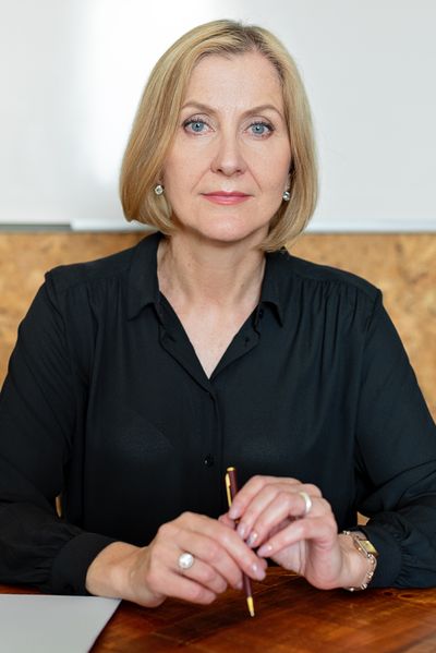 Portrait of a confident mortgage broker seated at her desk