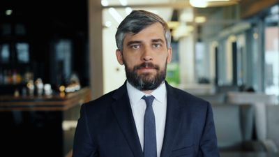 Portrait of a mortgage broker standing confidently indoors