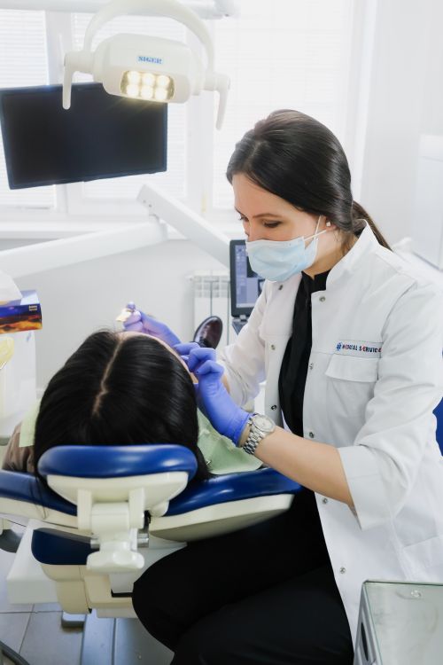 A dentist performing a dental check-up in a modern clinic setting