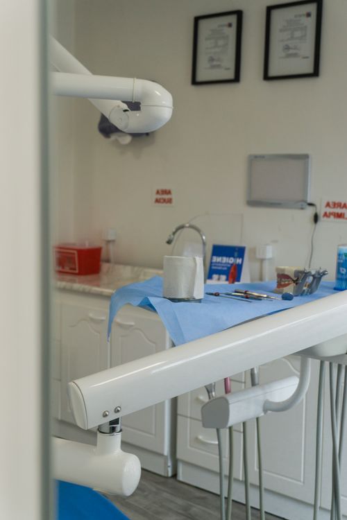 A clean and organised dental clinic with equipment ready for appointments