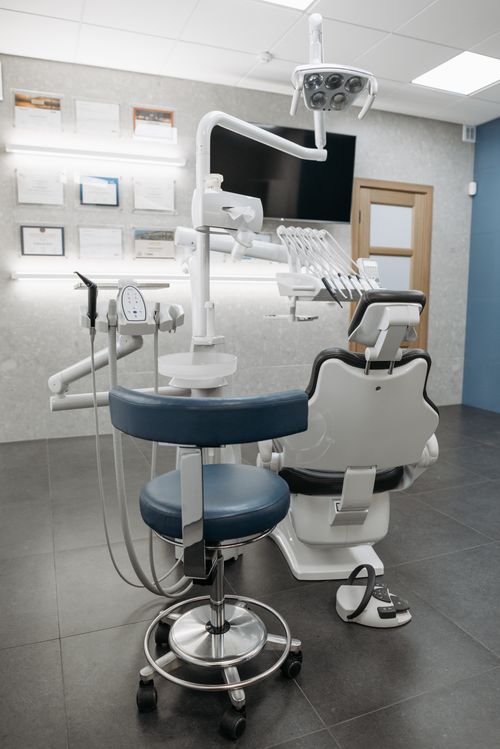 A contemporary dentist's surgery with modern equipment and an empty dental chair