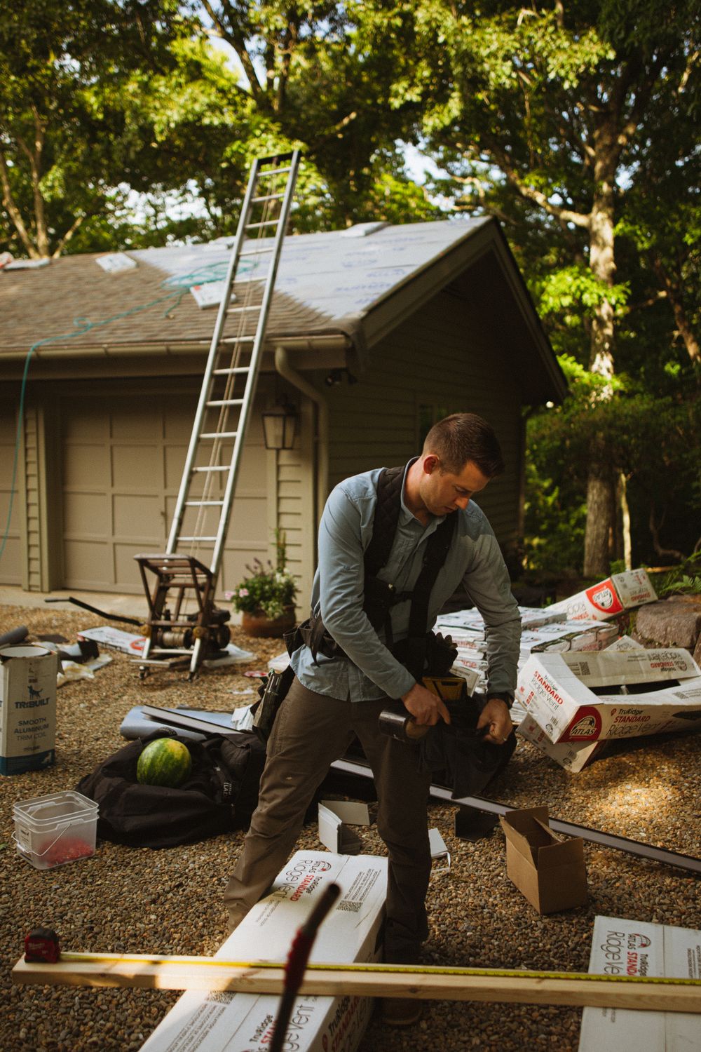 A roofing contractor working on a residential home