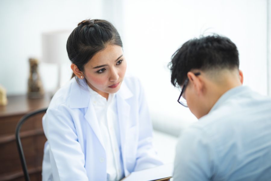 A doctor listening attentively to a patient during a medical consultation
