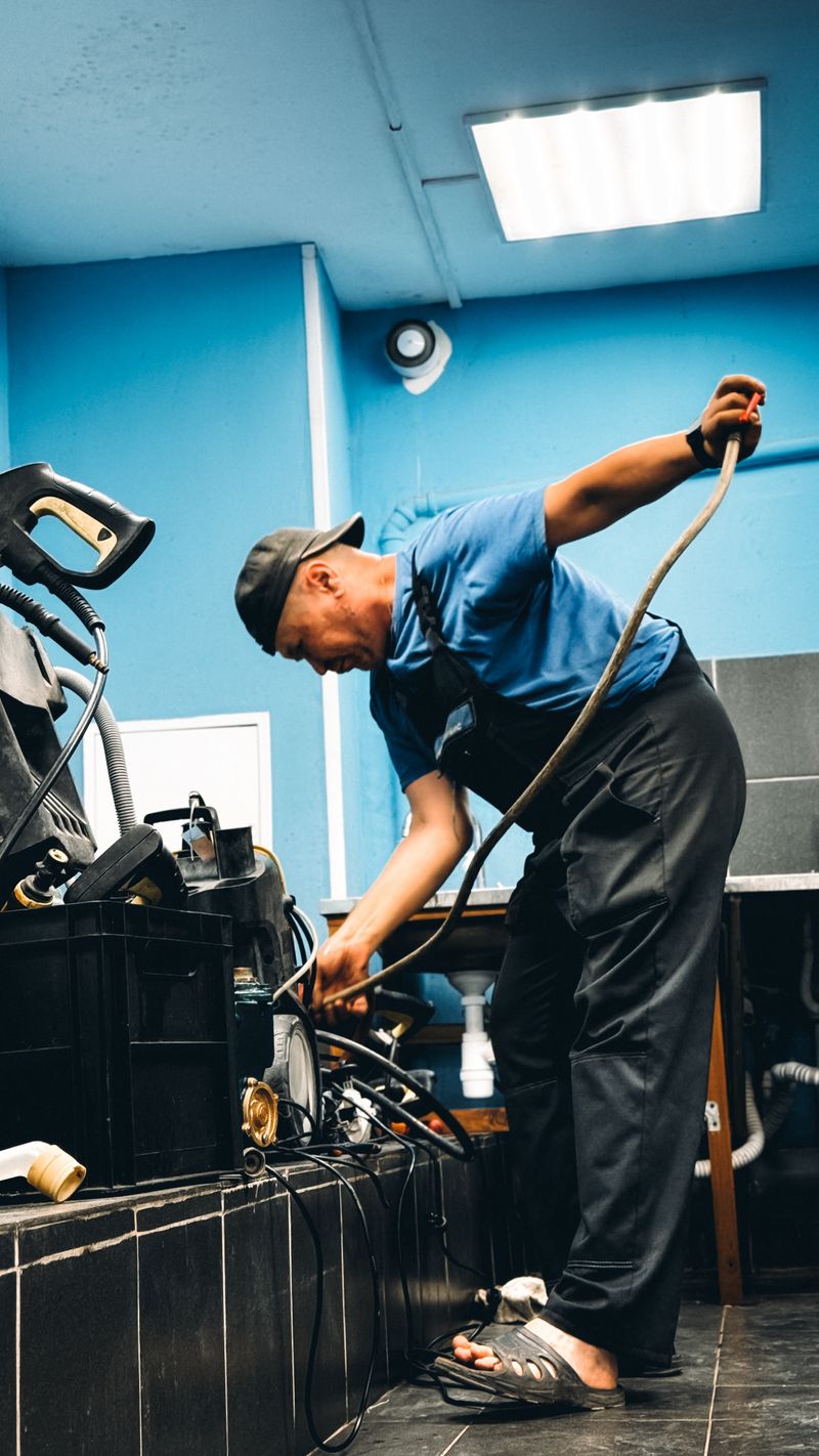 Tradesperson working with equipment in a workshop